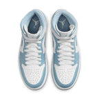 Air Jordan 1 Mid UNC 2022 for women, featuring a white and blue leather upper with classic mid-top design.