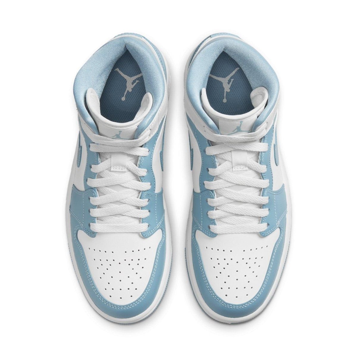Air Jordan 1 Mid UNC 2022 for women, featuring a white and blue leather upper with classic mid-top design.