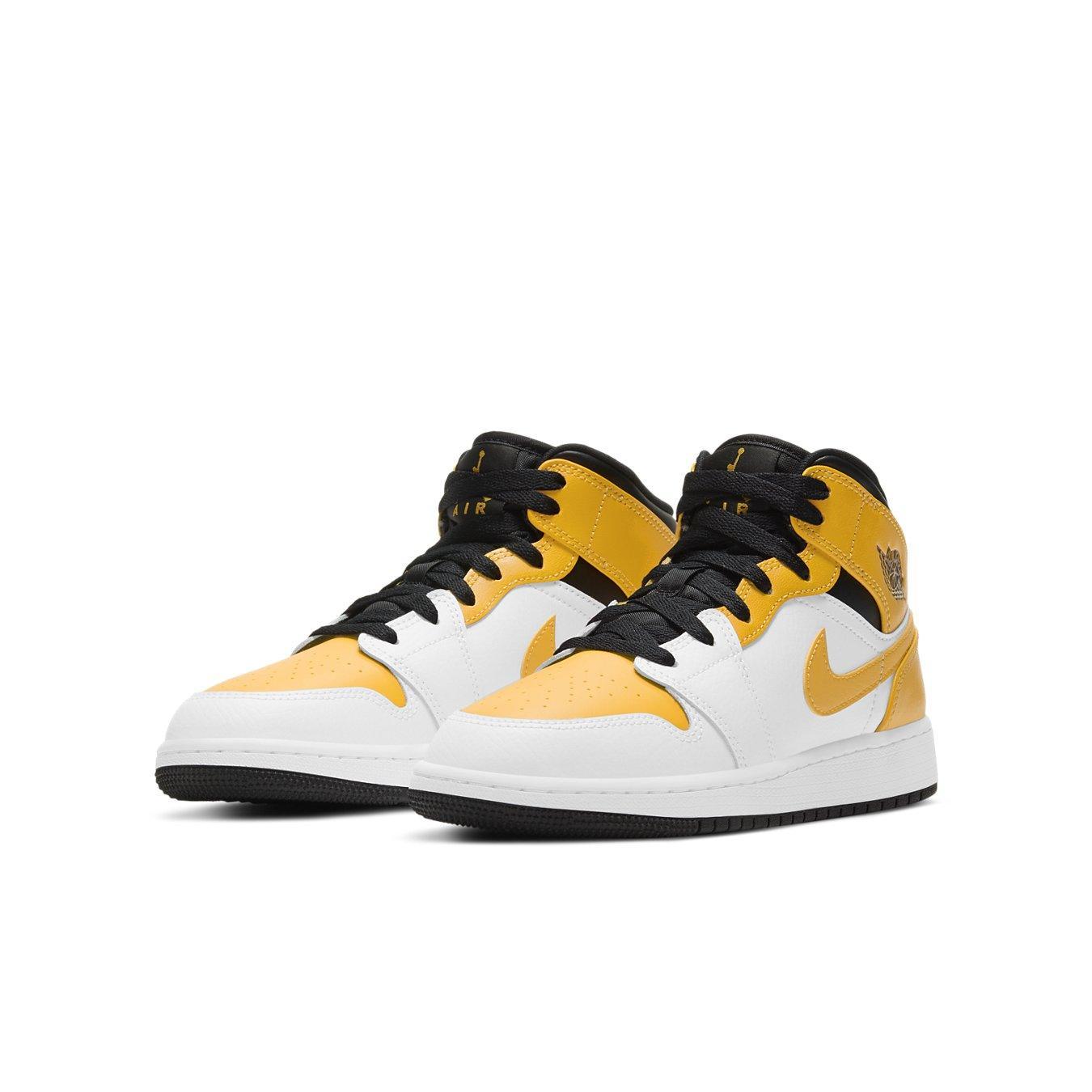 Jordan 1 Mid University Gold GS sneakers with black and white accents, showcasing vibrant yellow details.