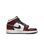 Air Jordan 1 Mid Wear-Away Chicago (GS) sneakers in white, black, and red colorway.