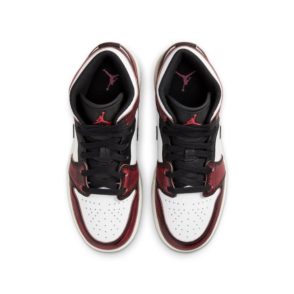 Top view of Jordan 1 Mid Wear-Away Chicago GS sneakers featuring black, white, and crimson colorway.