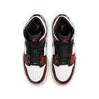 Top view of Jordan 1 Mid Wear-Away Chicago GS sneakers featuring black, white, and crimson colorway.