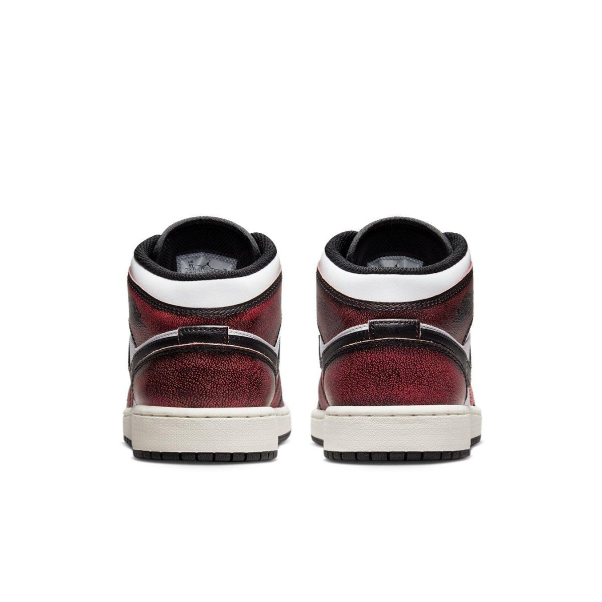 Rear view of the Air Jordan 1 Mid Wear-Away Chicago GS sneakers showcasing the red and black design.