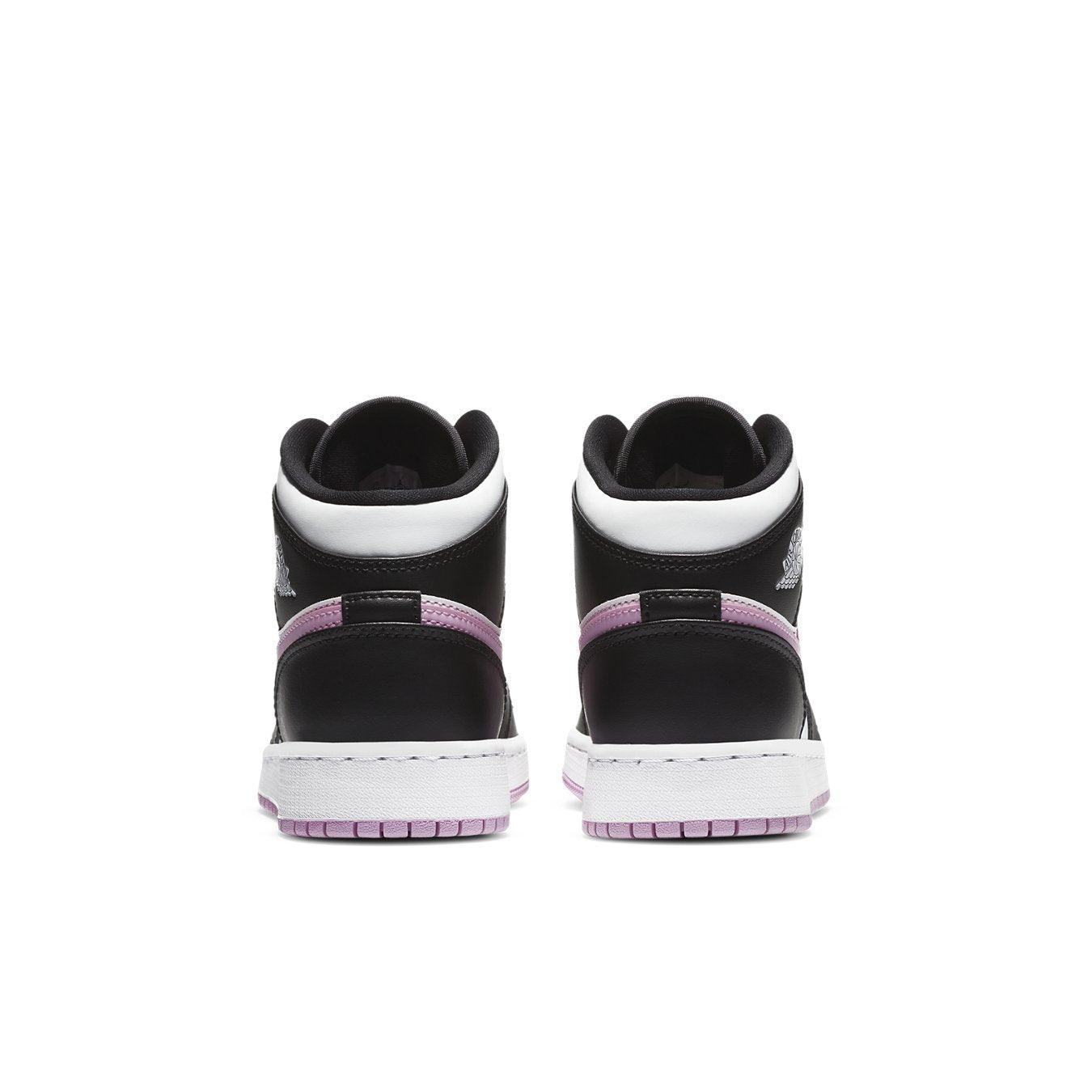 Jordan 1 Mid White Black Light Arctic Pink GS rear view showing black and pink accents on the sneaker.