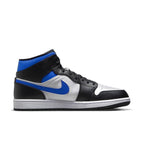 Jordan 1 Mid in White, Black, and Racer Blue with leather and textile materials, perfect for stylish sneakers.
