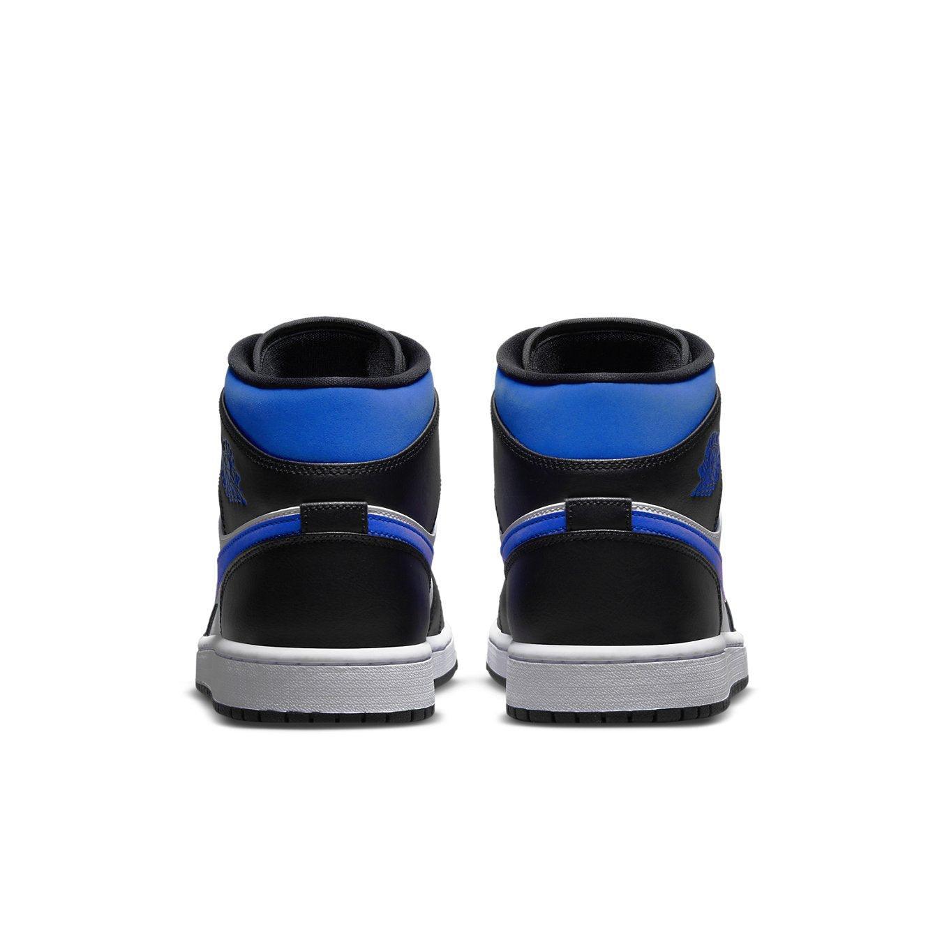 Back view of Jordan 1 Mid White Black Racer Blue sneakers showcasing black, blue, and white color design.