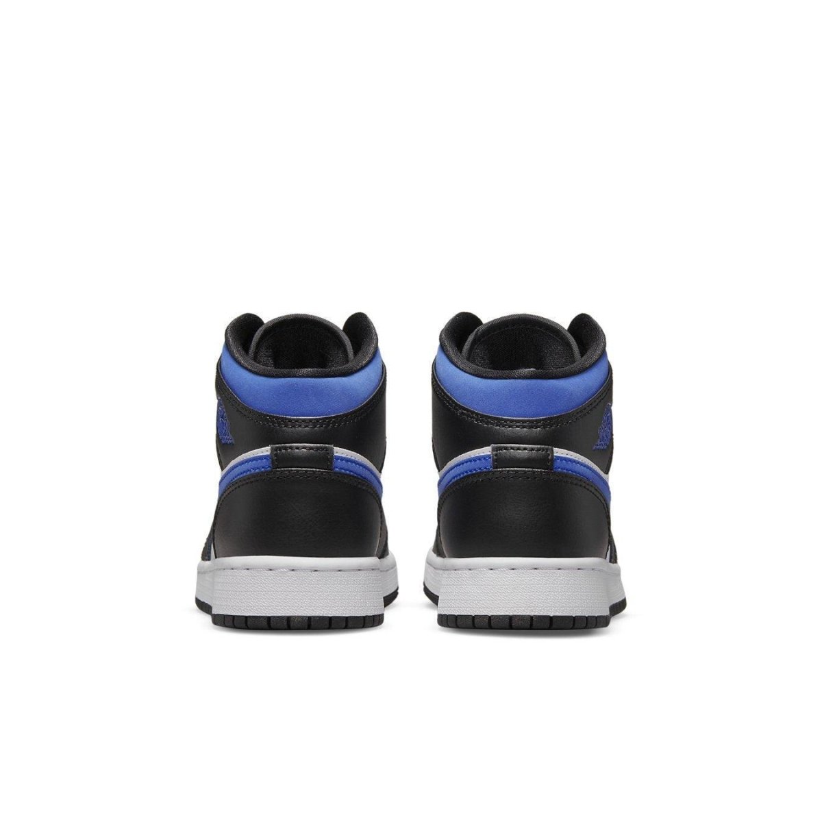 Back view of Air Jordan 1 Mid GS Racer Blue sneakers featuring black and royal blue colorway.