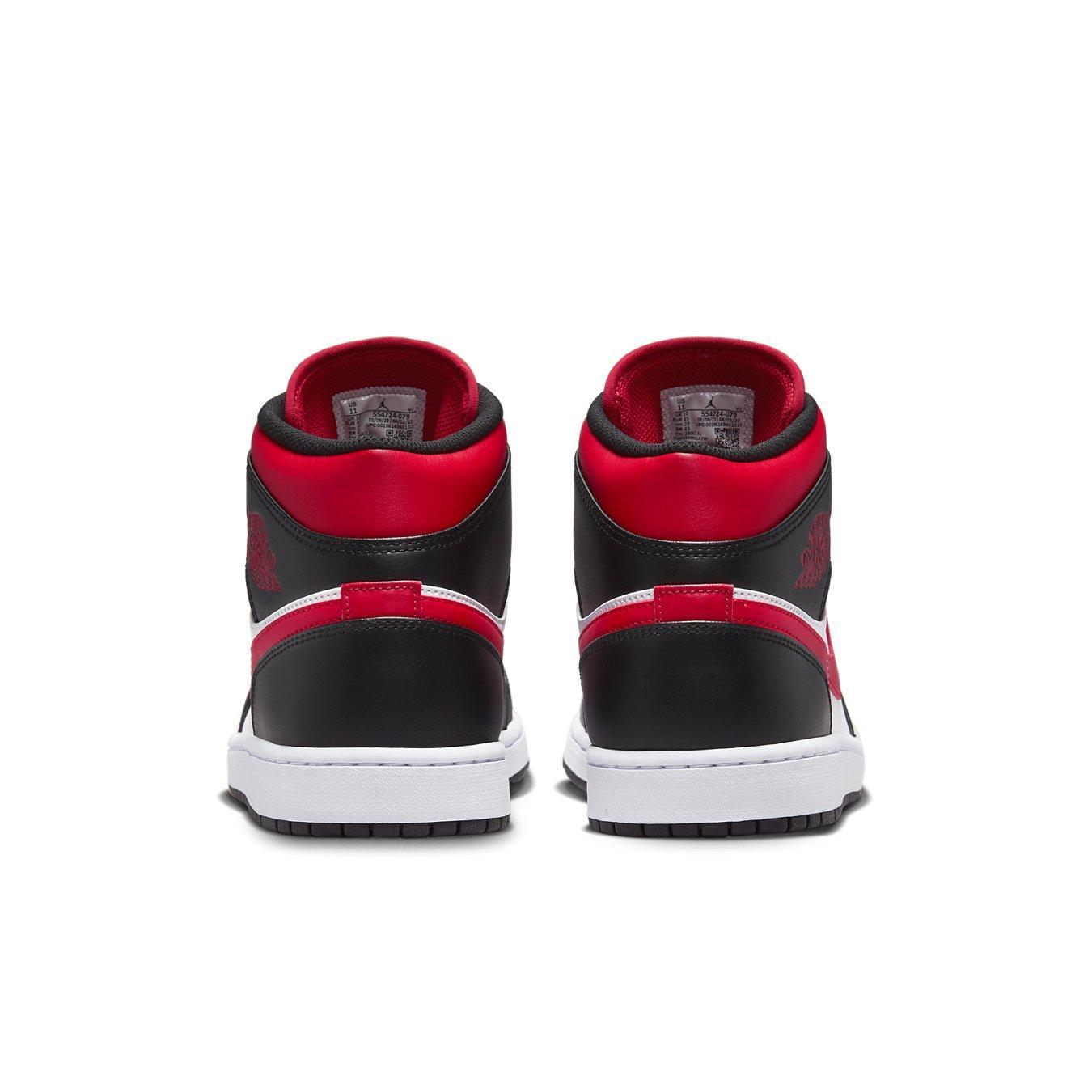 Jordan 1 Mid White Black Red 2022 sneakers rear view with oversized red tongue and black accents.