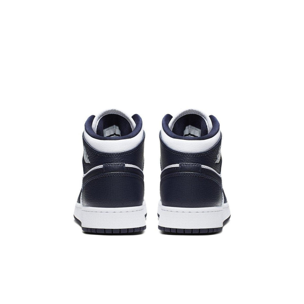 Back view of Air Jordan 1 Mid White Metallic Gold Obsidian sneakers showing navy blue and white design.