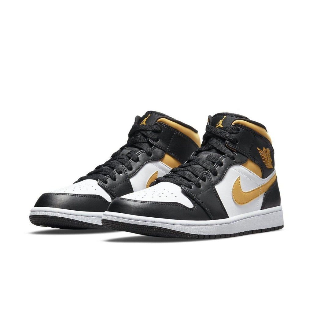 Jordan 1 Mid White Pollen Black sneakers featuring white, black, and gold colorway.
