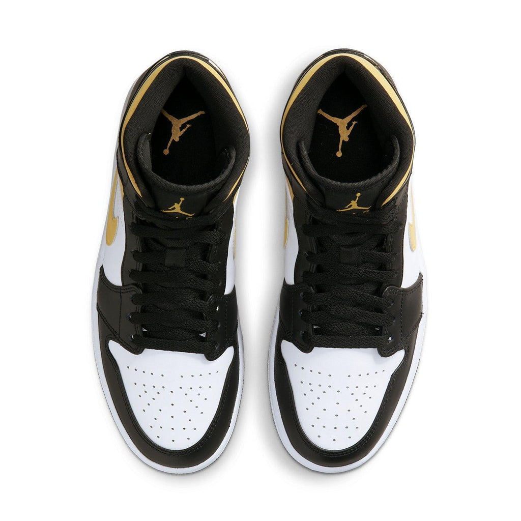 Top view of Jordan 1 Mid White Pollen Black sneakers featuring black and gold accents.