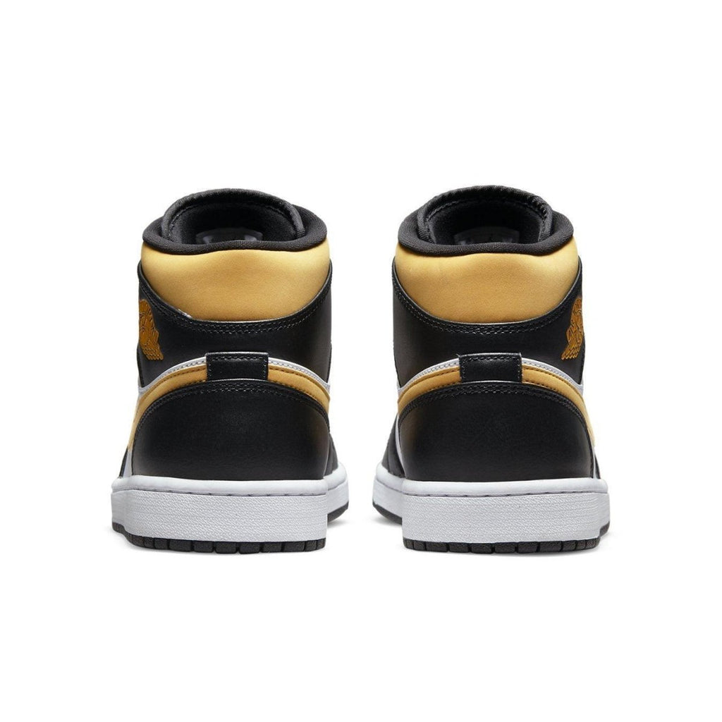 Jordan 1 Mid White Pollen Black sneakers, back view showcasing black and yellow design, ideal for casual wear.