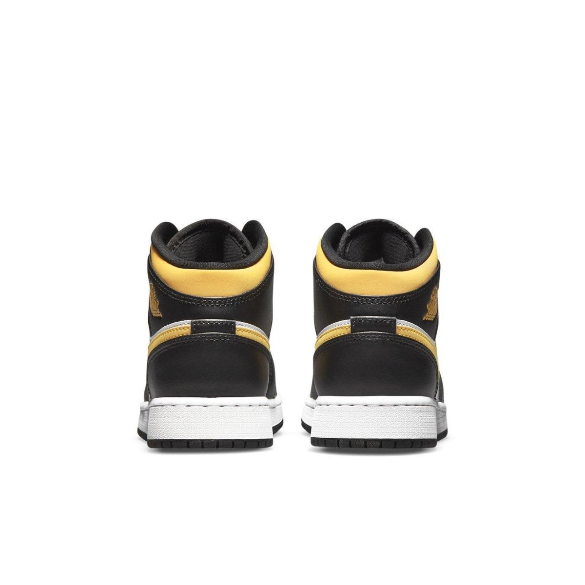 Air Jordan 1 Mid White Pollen Black (GS) sneaker, featuring black and yellow accents from the back view.