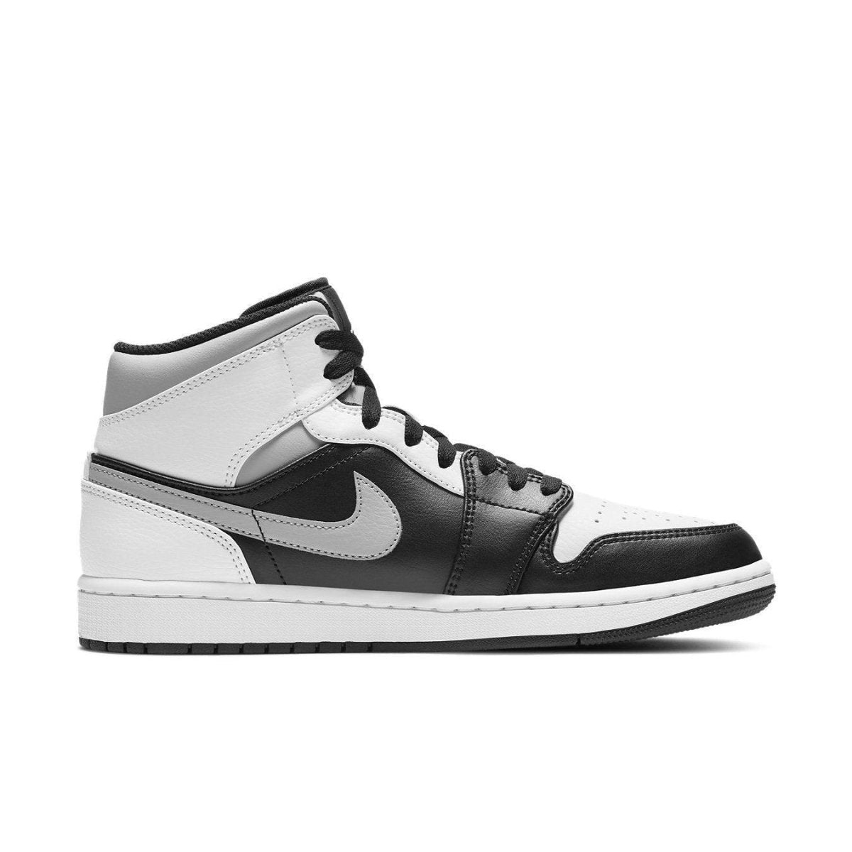 Air Jordan 1 Mid White Shadow sneaker featuring black leather and white accents with Nike swoosh.
