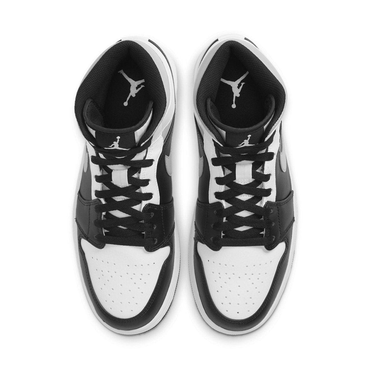 Air Jordan 1 Mid White Shadow shoes in black and white with classic Nike swoosh, top view.