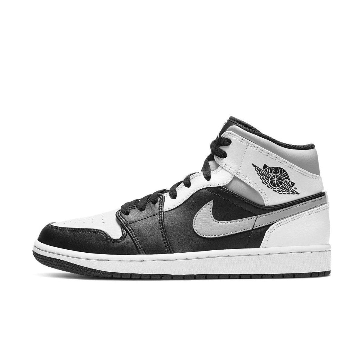 Air Jordan 1 Mid White Shadow sneakers featuring black and white leather design with Nike swoosh.
