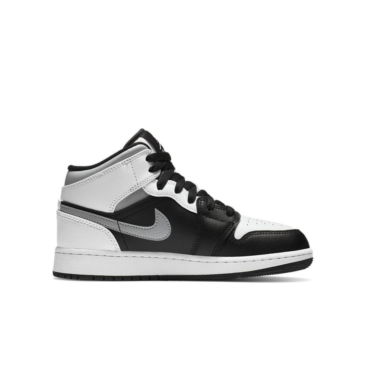 Jordan 1 Mid White Shadow (GS) featuring black and white leather, iconic Nike swoosh, and classic design.