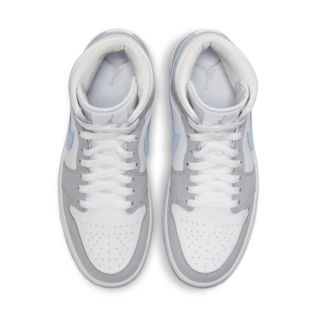 Jordan 1 Mid Wolf Grey Aluminum women's sneakers featuring grey suede, blue Swoosh, and icy soles.