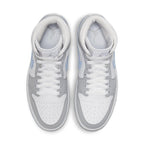 Jordan 1 Mid Wolf Grey Aluminum women's sneakers featuring grey suede, blue Swoosh, and icy soles.