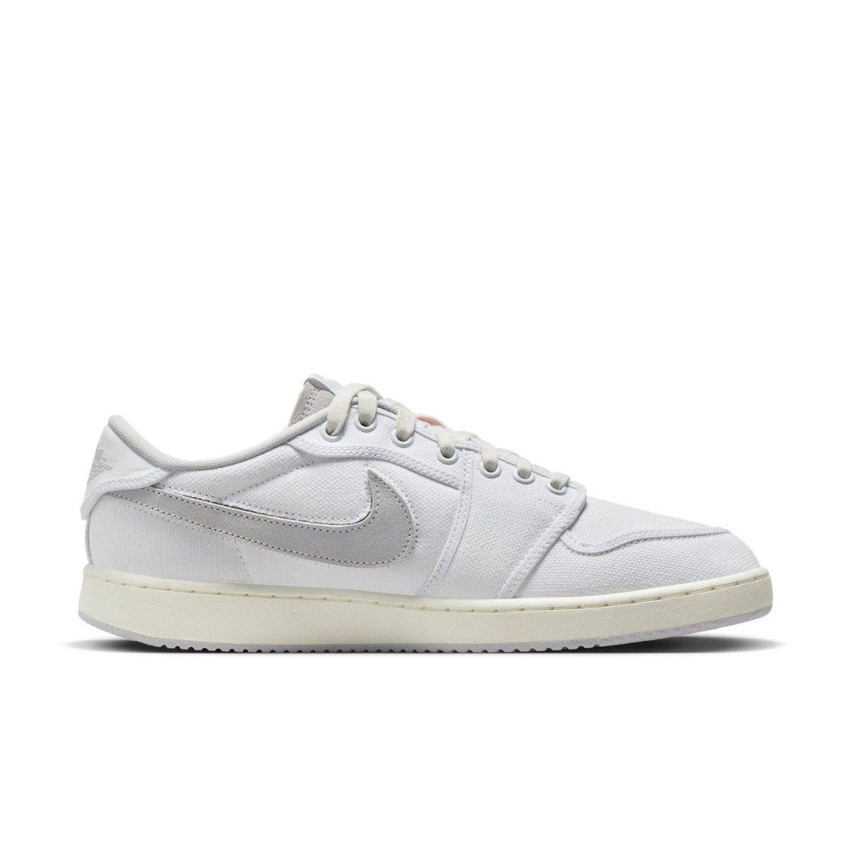 Air Jordan 1 Retro AJKO Low SP Union in white and neutral grey, featuring a canvas upper and signature Swoosh logo.