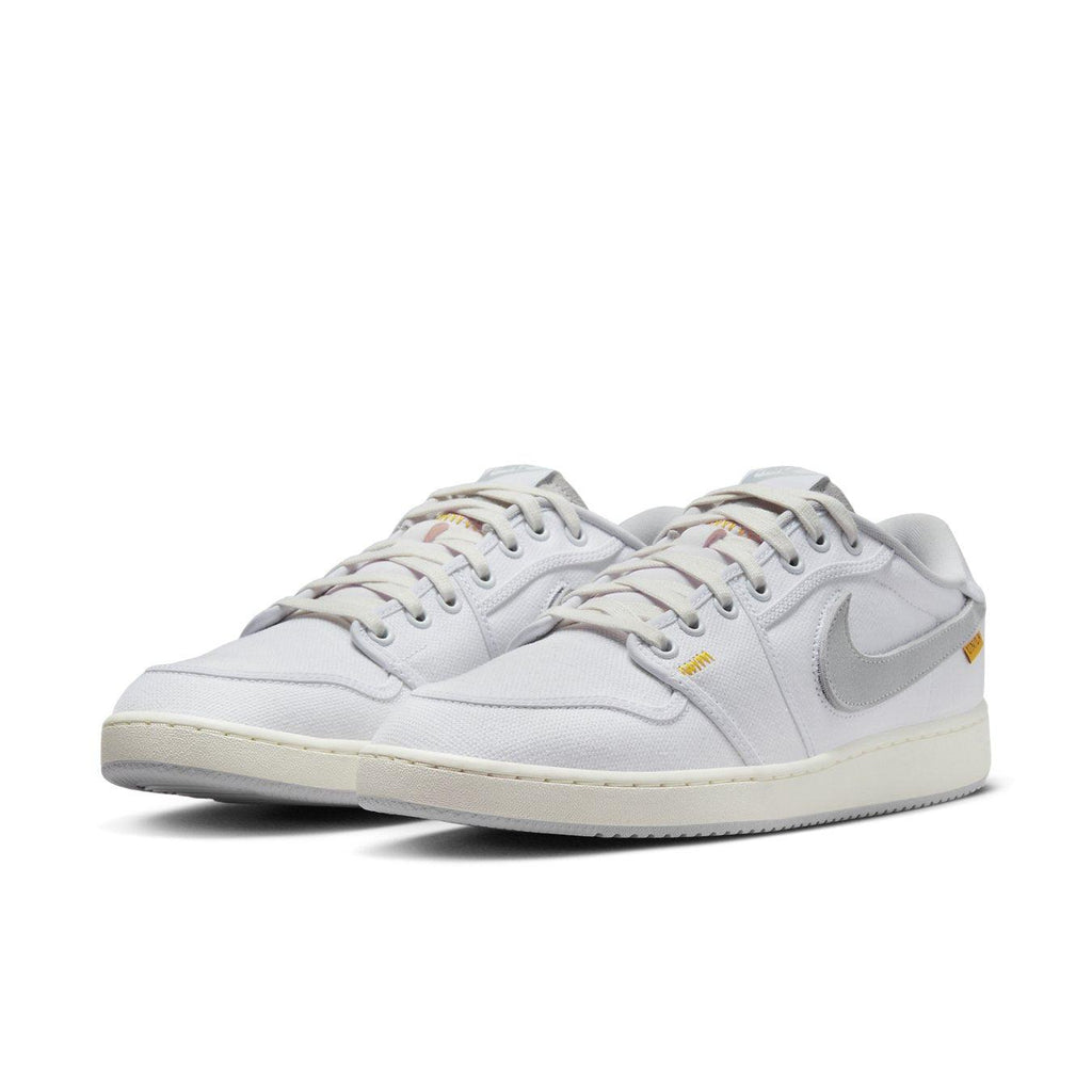 Air Jordan 1 Retro AJKO Low SP Union in White and Neutral Grey, featuring cotton twill detailing and signature Swoosh.