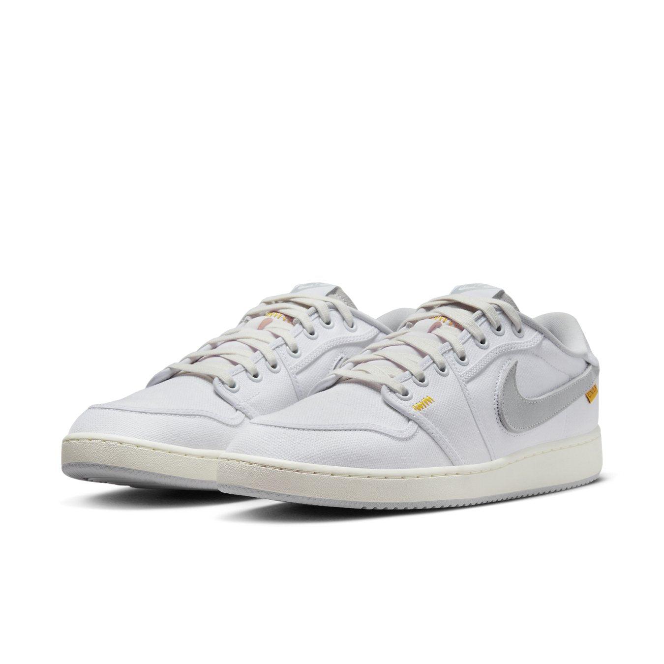 Air Jordan 1 Retro AJKO Low SP Union in White and Neutral Grey, featuring cotton twill detailing and signature Swoosh.