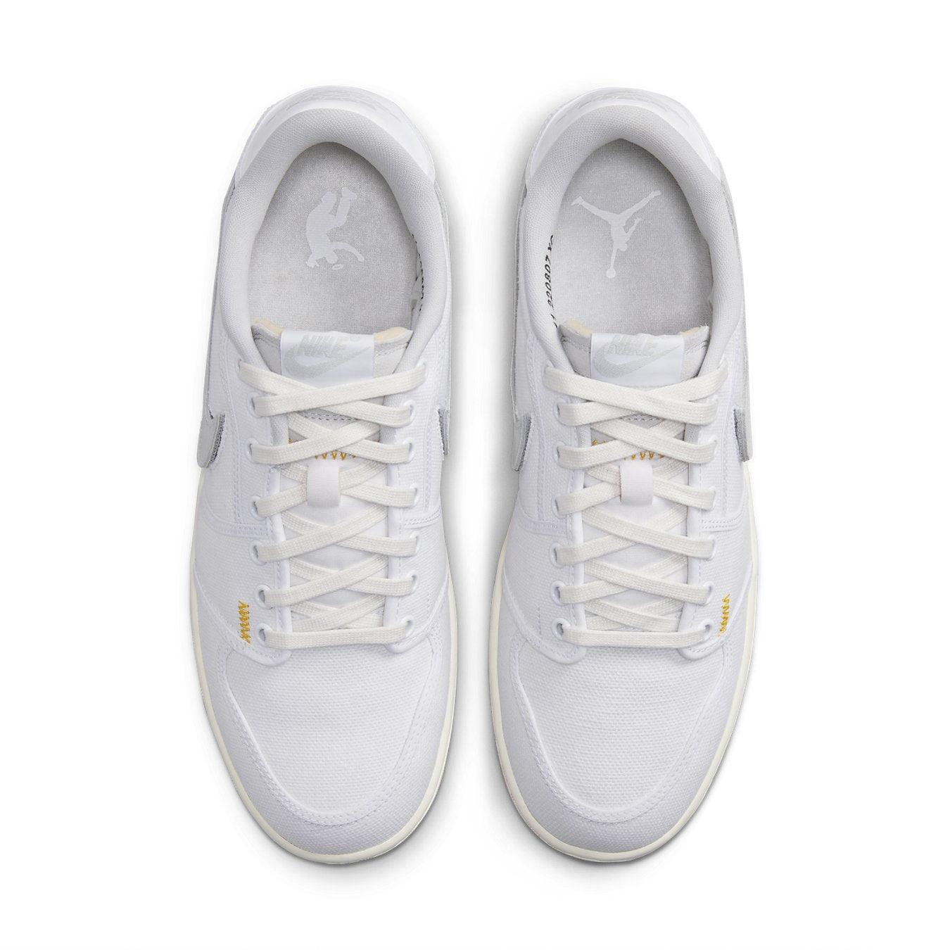 Air Jordan 1 Retro AJKO Low SP Union in white with neutral grey accents and detailed stitching, viewed from above.