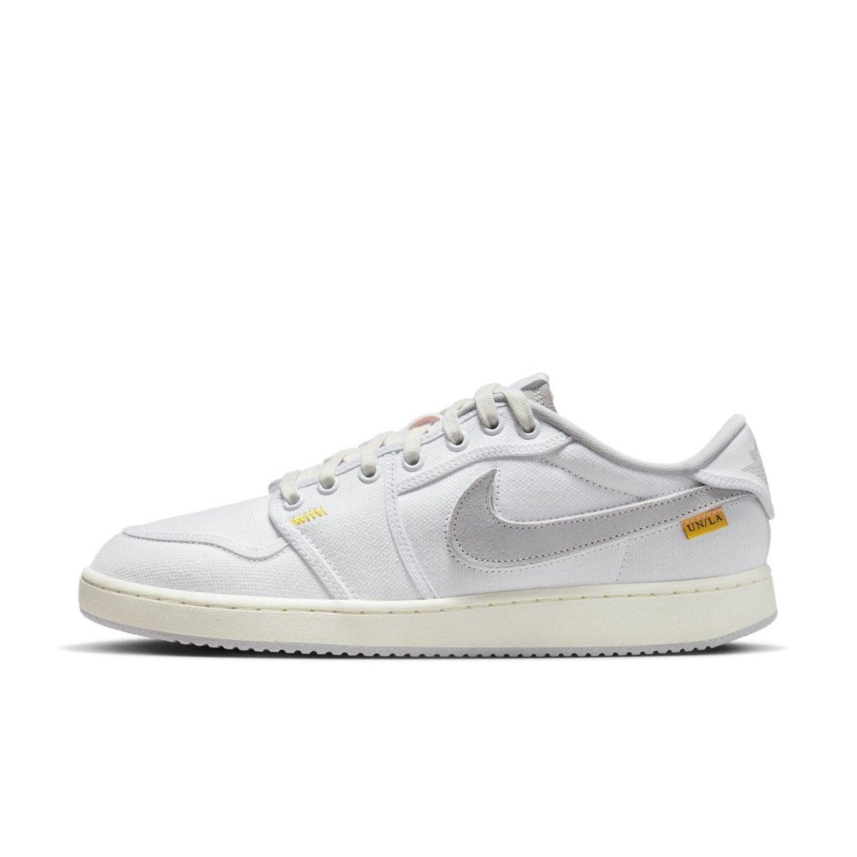 Air Jordan 1 Retro AJKO Low SP Union in white and neutral grey, featuring a cotton twill finish and classic silhouette.