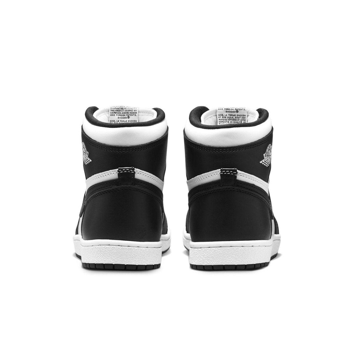 Rear view of the Jordan 1 Retro High 85 Black White shoes showcasing smooth black leather and mesh lining.