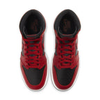 Top view of Jordan 1 Retro High 85 Varsity Red sneakers with black and red leather design.