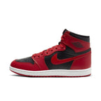 Air Jordan 1 Retro High 85 Varsity Red sneakers featuring black and red leather design with white midsole.