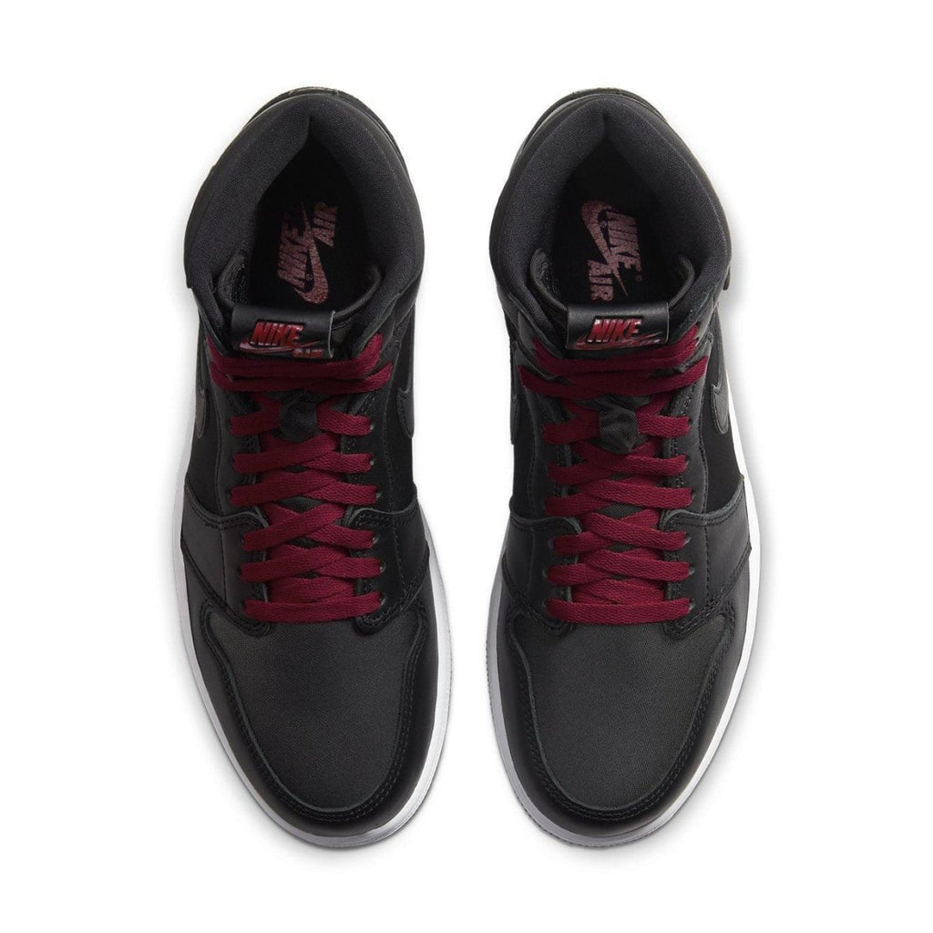 Top view of Air Jordan 1 Retro High Black Satin Gym Red sneakers featuring black leather and burgundy laces.