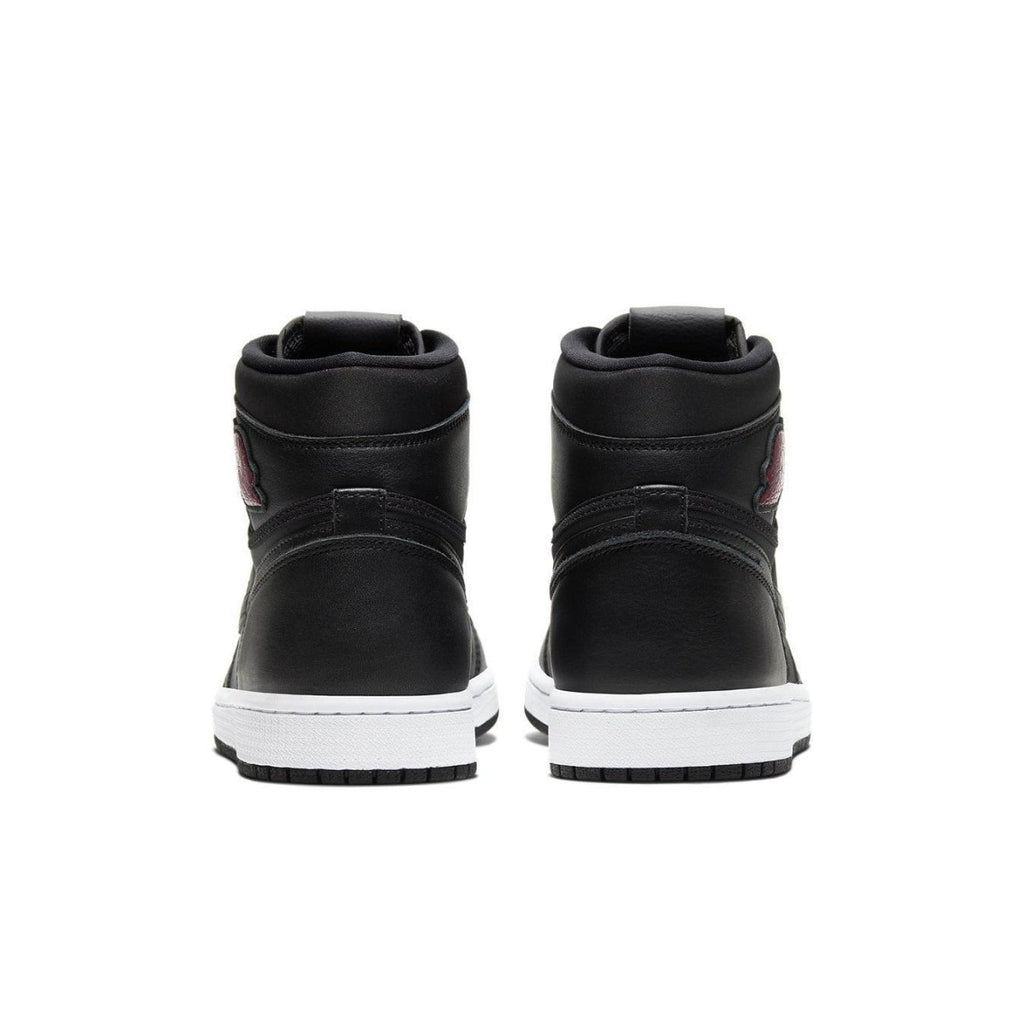 Back view of Jordan 1 Retro High Black Satin Gym Red sneaker showing sleek black leather design and Gym Red accents.