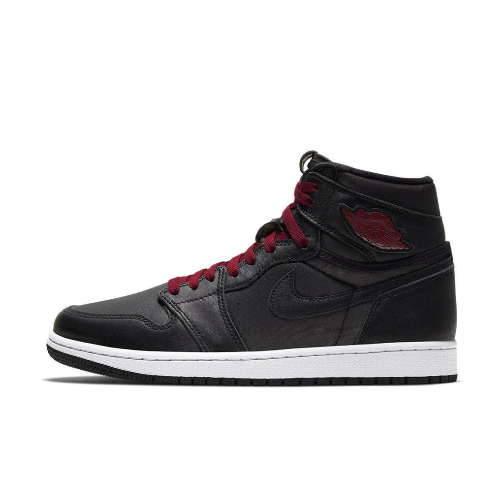 Air Jordan 1 Retro High Black Satin Gym Red sneaker with leather upper and red accents, showcasing classic basketball style.