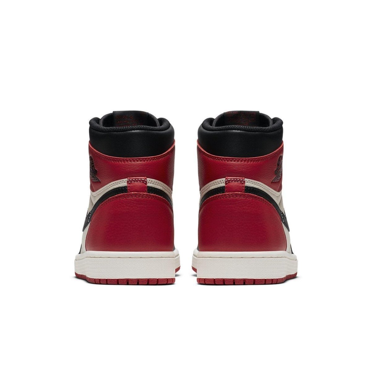 Back view of Air Jordan 1 Retro High Bred Toe sneakers showcasing red and black leather detailing.