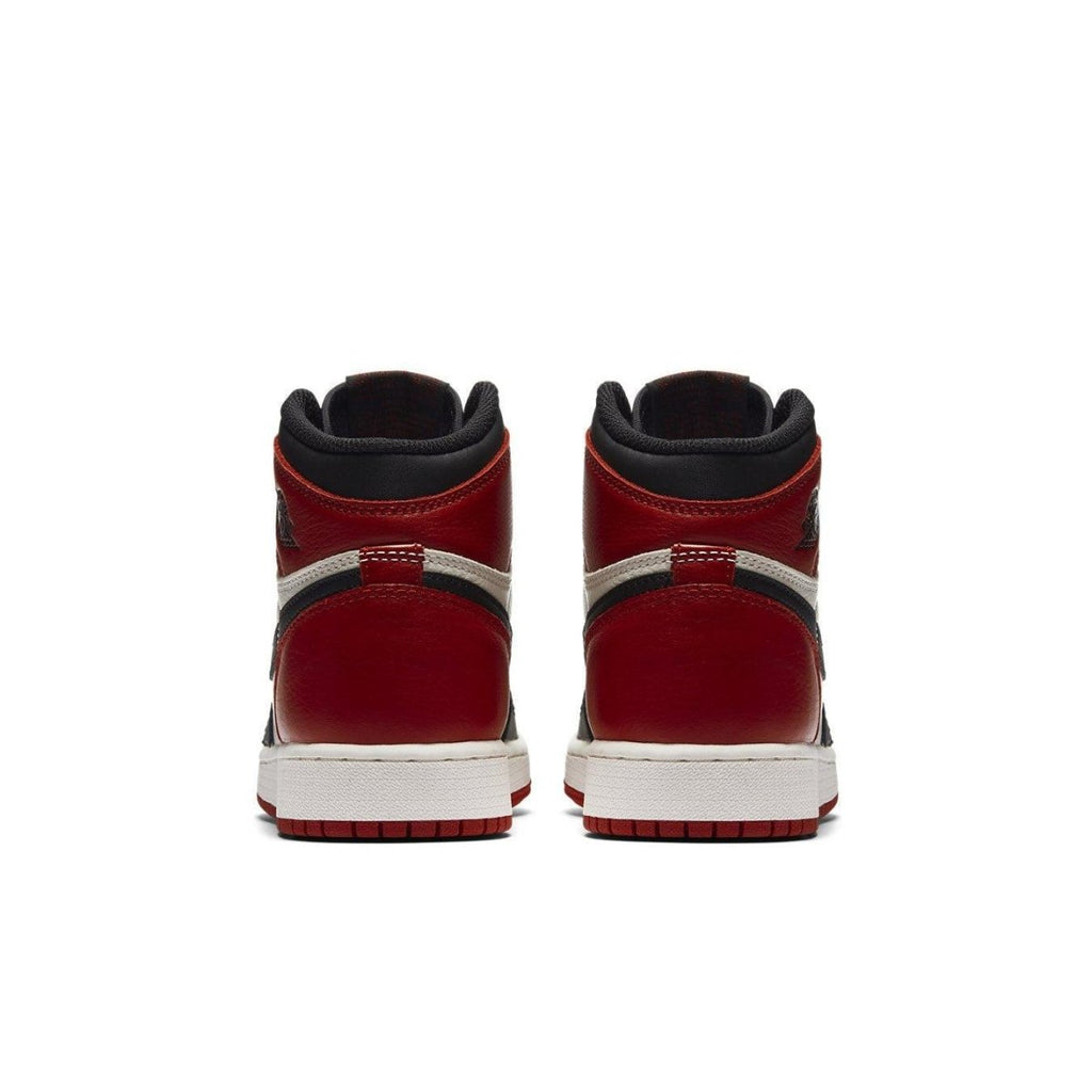 Back view of Jordan 1 Retro High Bred Toe sneakers showcasing red leather and black accents.