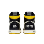 Jordan 1 Retro High 'Not for Resale' in black and yellow with 'NO PHOTOS' text on the back.