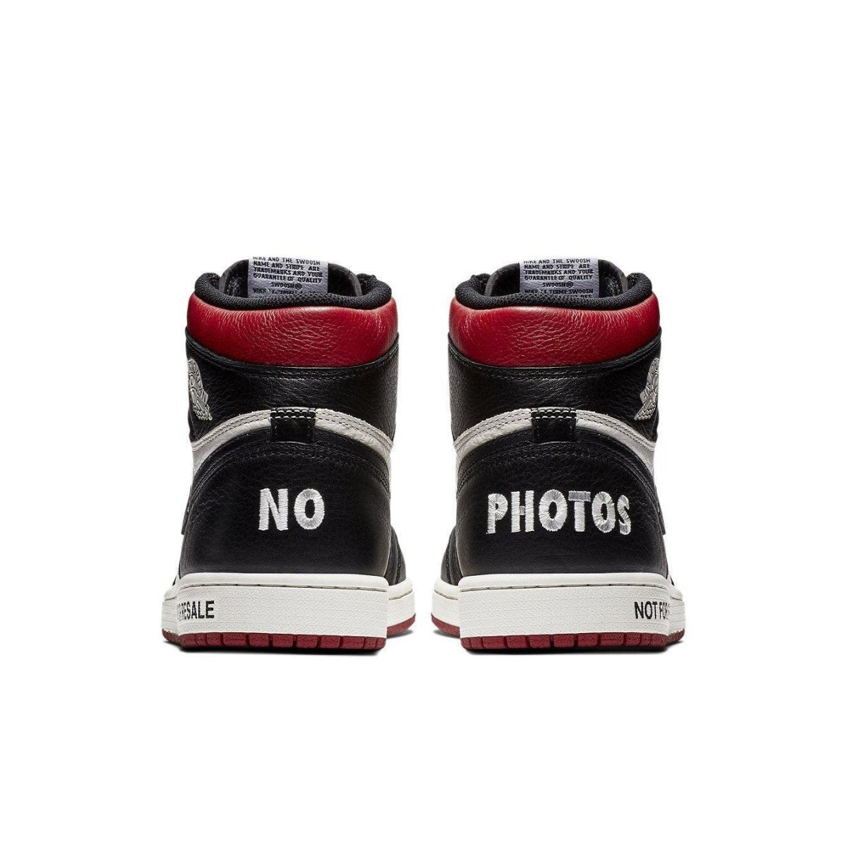 Back view of Air Jordan 1 Retro High 'Not for Resale' in Varsity Red, featuring 'NO PHOTOS' on the heels.