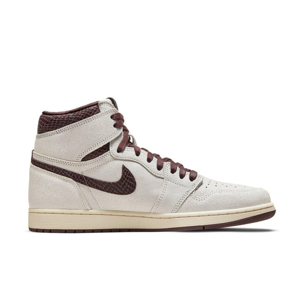 Jordan 1 Retro High OG A Ma Maniére in light gray and burgundy, highlighting premium materials and classic design.