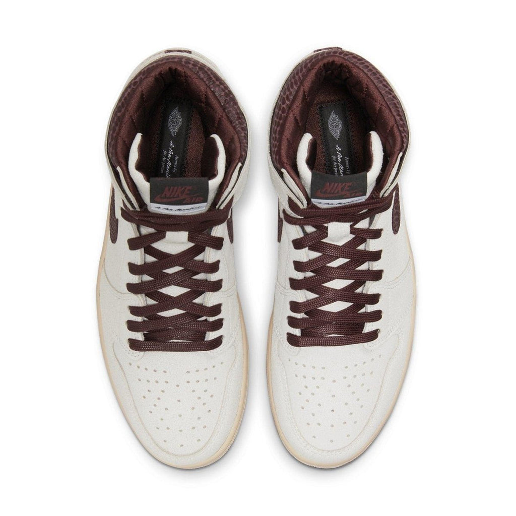 Jordan 1 Retro High OG A Ma Maniére, luxurious white and maroon sneaker, top view showcasing design and details.