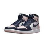 Air Jordan 1 Retro High OG Atmosphere (W) featuring pink and navy colorway, styled with iconic Air logo.