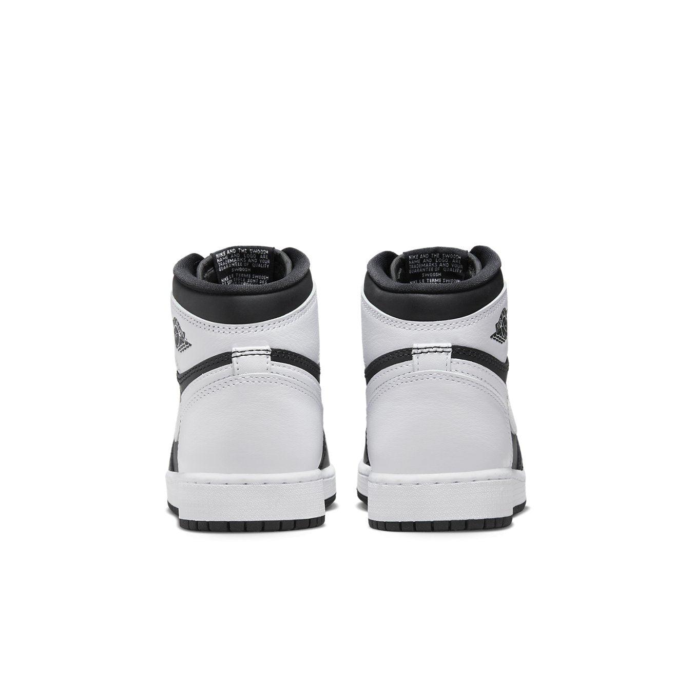 Retro Jordan 1 High OG Black White (GS) sneakers showcasing premium leather design and classic branding from the rear.
