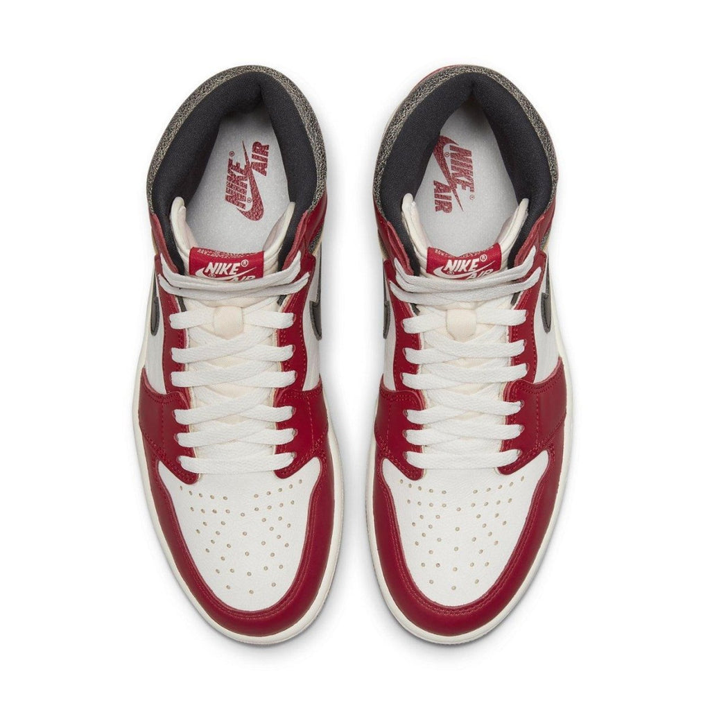 Top view of the Jordan 1 Retro High OG Chicago Lost and Found sneakers with red, white, and black colorway.