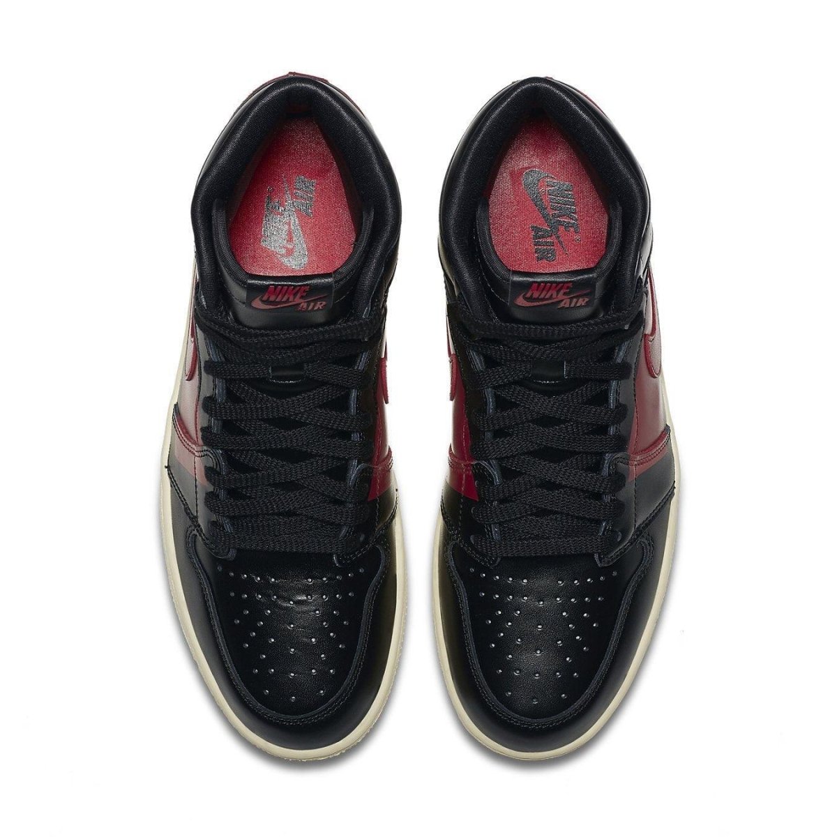 Top view of Air Jordan 1 Retro High OG Defiant Couture black and red sneakers with perforated toe.