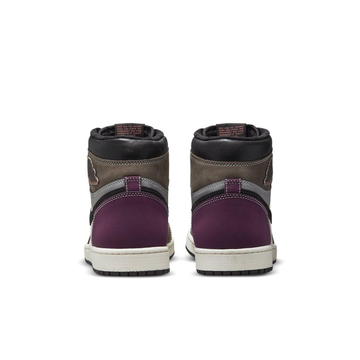 Back view of Air Jordan 1 Retro High OG Hand Crafted, showcasing purple and brown leather uppers.