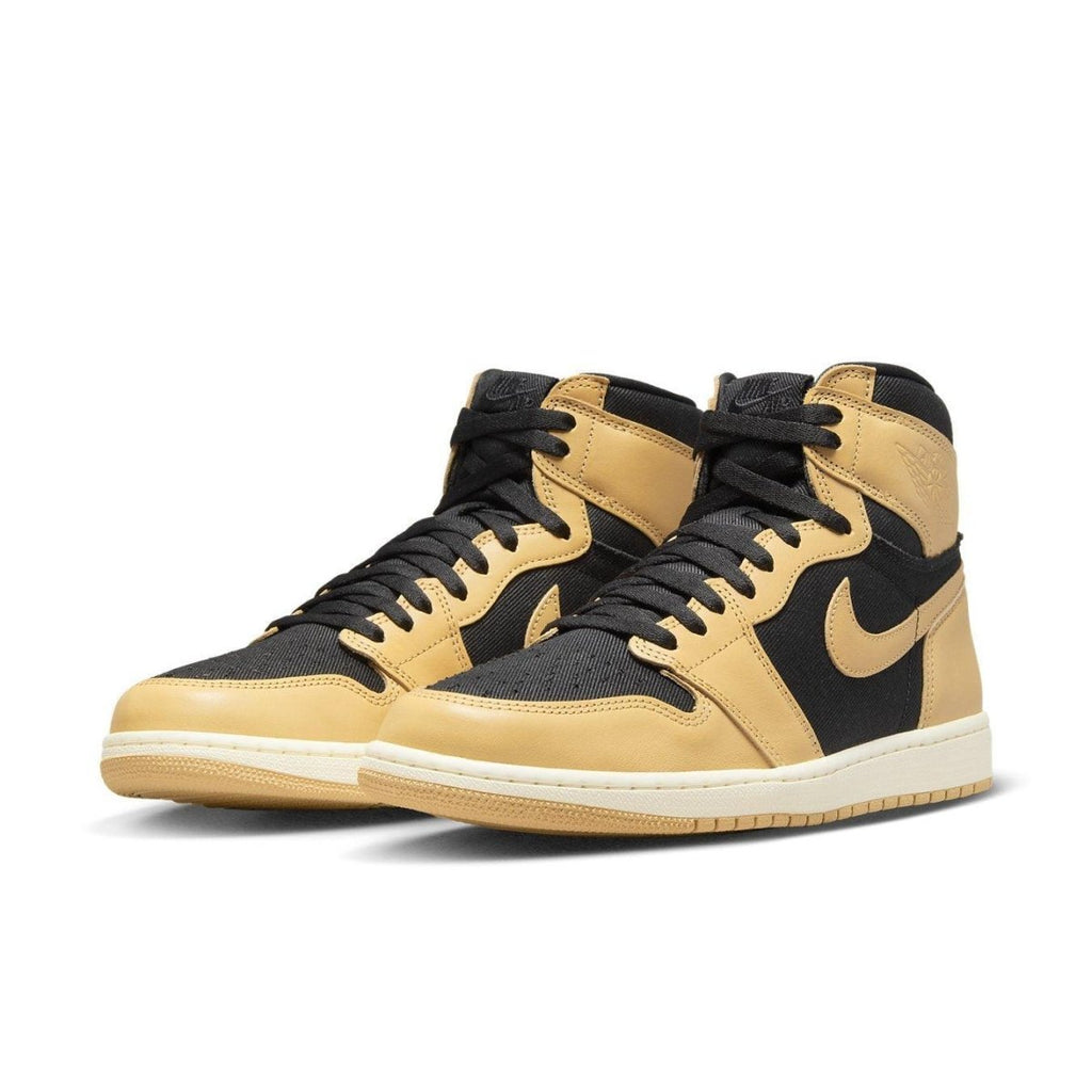 Air Jordan 1 Retro High OG Heirloom sneakers in black twill and Vachetta Tan leather, featuring iconic silhouette.