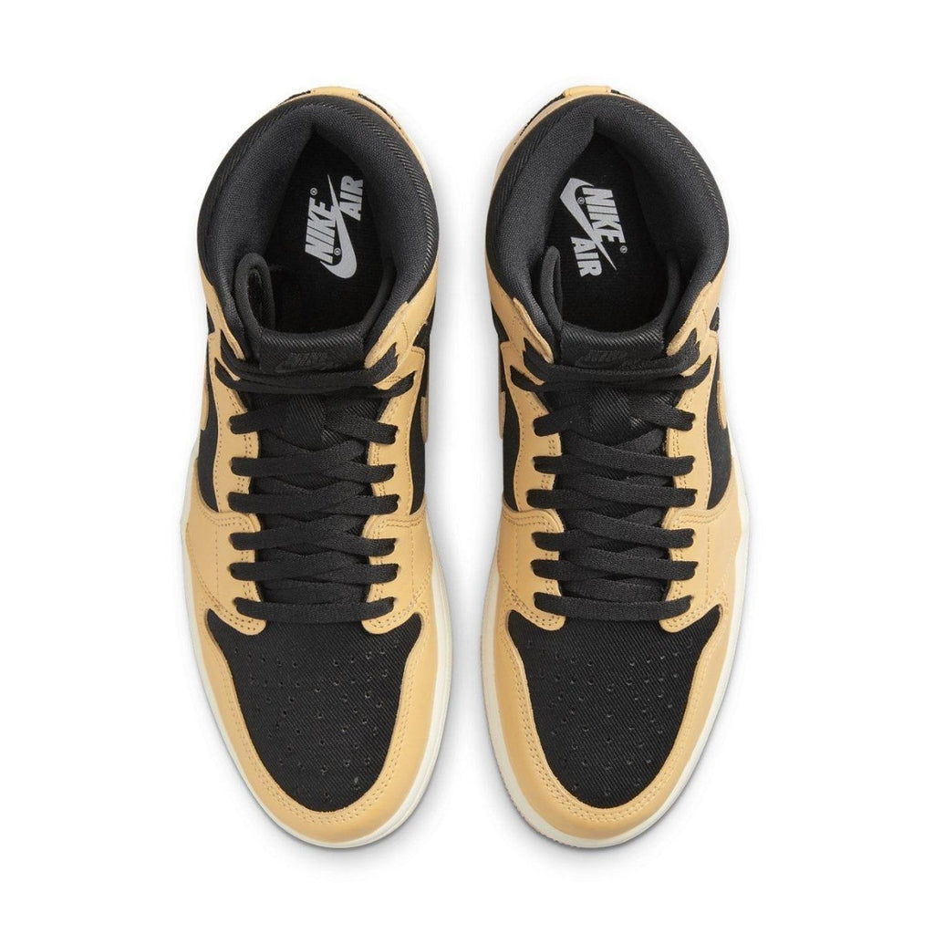 Top view of Jordan 1 Retro High OG Heirloom sneakers with black and Vachetta Tan design and Nike Air branding.