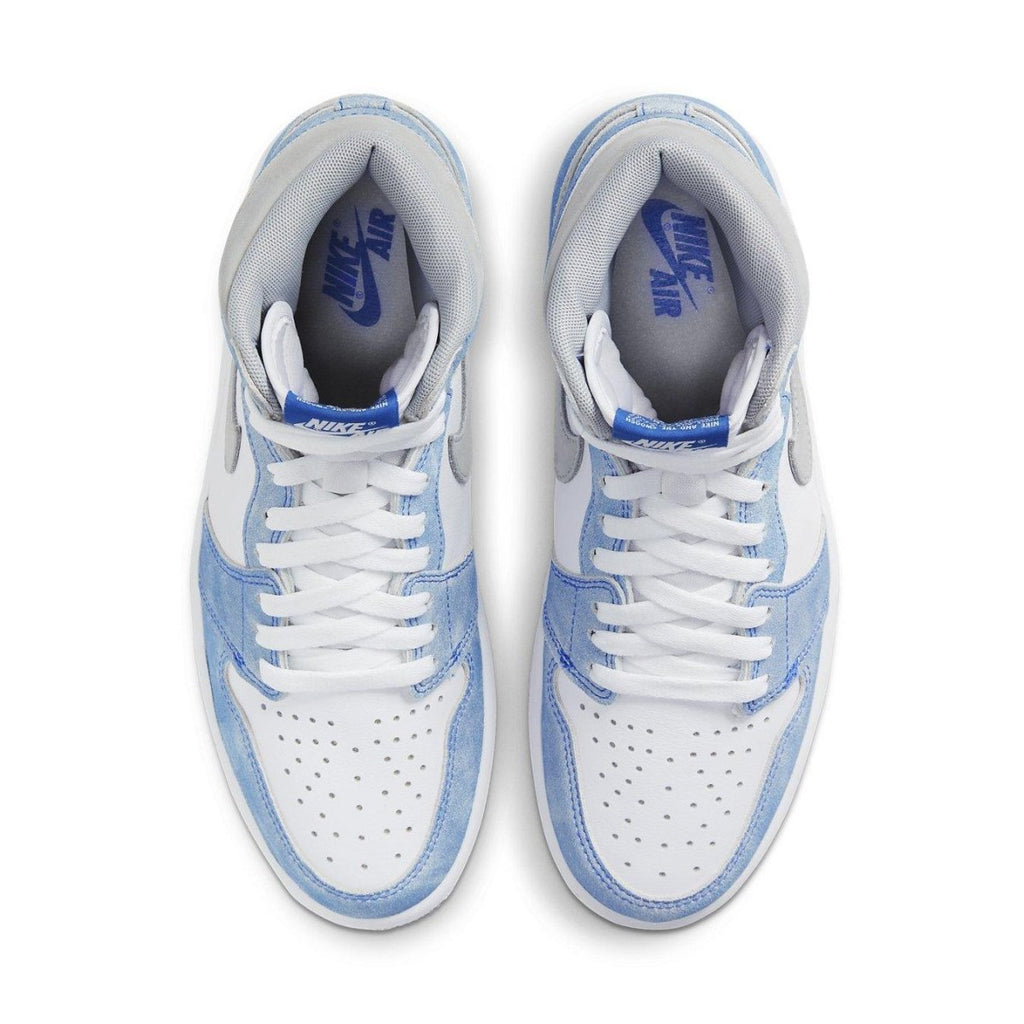 Top view of Jordan 1 Retro High OG Hyper Royal sneakers featuring white leather and faded blue suede.
