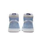 Retro high-top sneakers in faded blue suede with gray accents and classic Jordan design details.