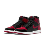 Air Jordan 1 Retro High OG Patent Bred in black and Varsity Red, showcasing glossy finish and classic design elements.